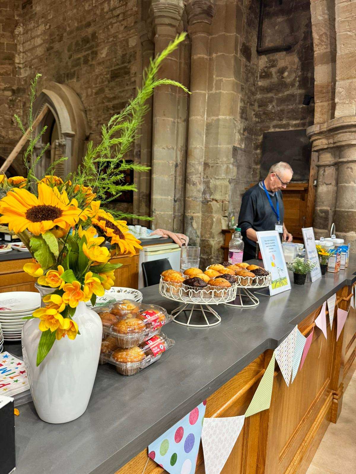 Cakes and sunflowers on the table at a SoundCafe session